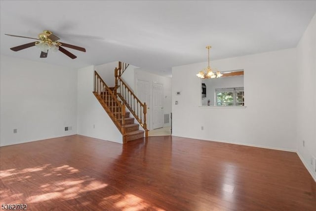450 Saint Giles Ct, Franklin Twp, NJ 08873 - unfurnished living room with wood finished floors, stairs, a chandelier, and ceiling fan