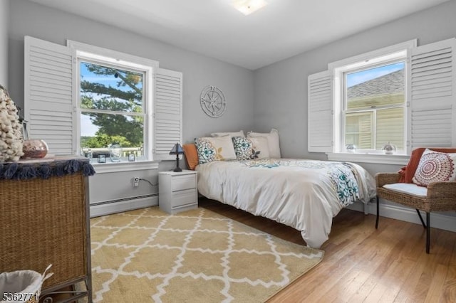 41 College Rd, Netcong Boro, NJ 07857 - bedroom with a baseboard heating unit and light wood-style flooring