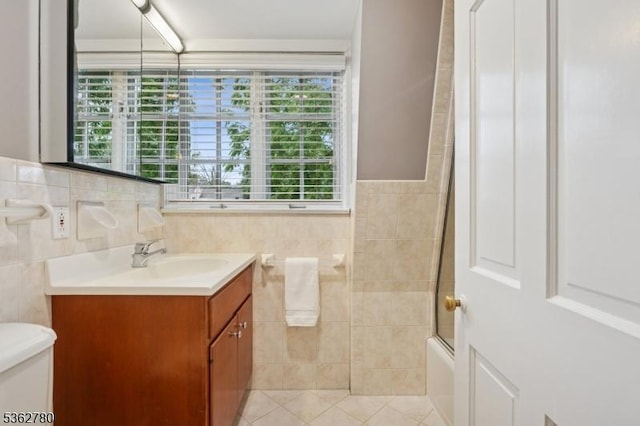 88 Pomeroy Rd, Madison Boro, NJ 07940 - bathroom featuring vanity, tile walls, shower / bath combination with glass door, and tile patterned flooring