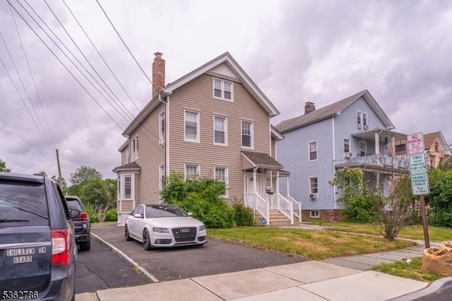90 Thomas St, Bloomfield Twp, NJ 07003 - view of front of house featuring a chimney