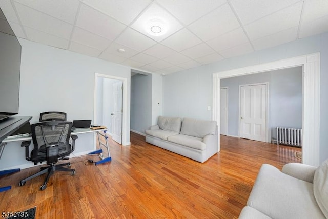 90 Thomas St, Bloomfield Twp, NJ 07003 - home office featuring radiator heating unit, wood finished floors, and a paneled ceiling