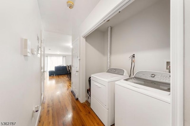 303-305 W Runyon St, Newark City, NJ 07108 - washroom with washing machine and clothes dryer and light wood-style floors