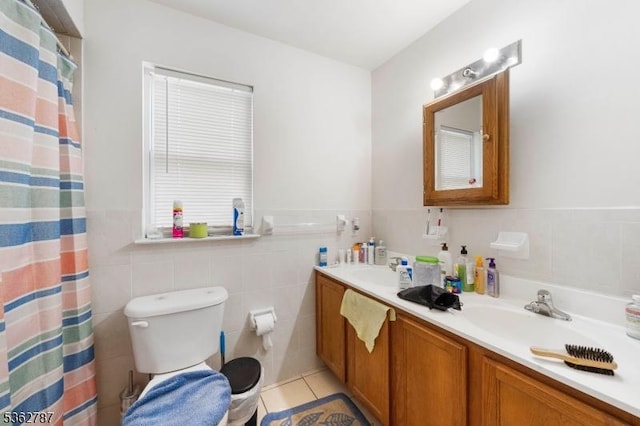 303-305 W Runyon St, Newark City, NJ 07108 - full bath featuring tile walls, double vanity, tile patterned flooring, toilet, and wainscoting