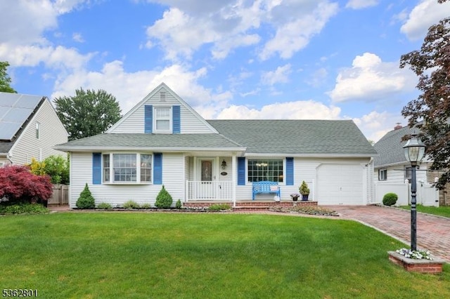 223 E Ln, Clark Twp, NJ 07066 - view of front of property with an attached garage, covered porch, decorative driveway, a front yard, and roof with shingles