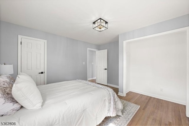 501 E 2nd Ave, Roselle Boro, NJ 07203 - bedroom with wood finished floors and baseboards