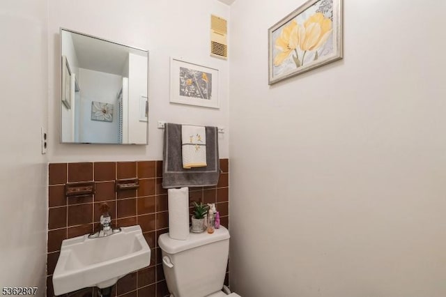 46A James St Unit B, Newark City, NJ 07102 - half bathroom with a sink, tile walls, toilet, and wainscoting