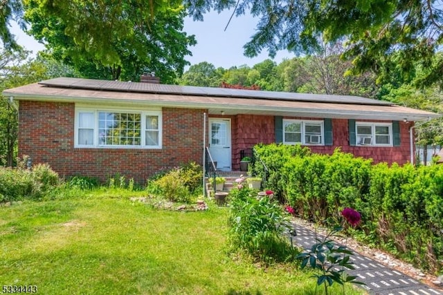 138 Bartley Flanders Rd, Mount Olive Twp, NJ 07836 - single story home featuring a front yard, solar panels, a chimney, and brick siding