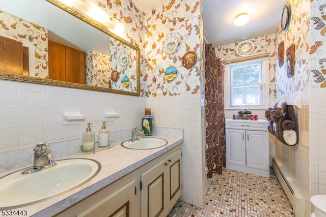 138 Bartley Flanders Rd, Mount Olive Twp, NJ 07836 - bathroom featuring wallpapered walls, a baseboard radiator, tile walls, double vanity, and a wainscoted wall