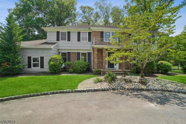 8 Debra Ct, Scotch Plains Twp, NJ 07076 - view of front of house with a balcony, a front lawn, and brick siding