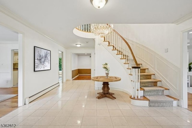 8 Debra Ct, Scotch Plains Twp, NJ 07076 - foyer featuring baseboard heating, ornamental molding, stairway, light tile patterned flooring, and a chandelier