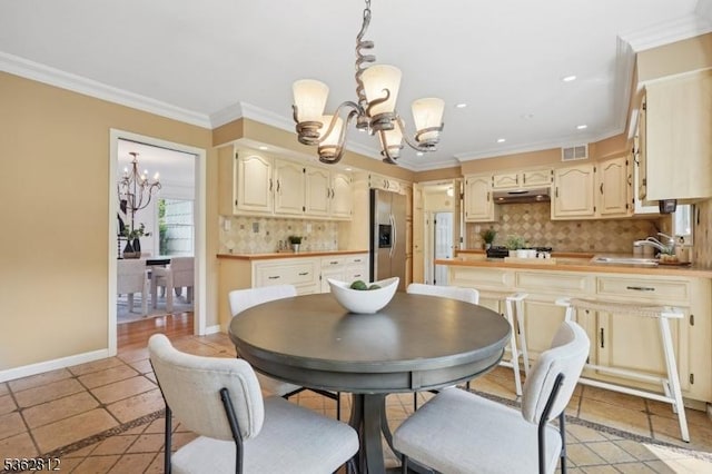 8 Debra Ct, Scotch Plains Twp, NJ 07076 - dining space featuring a chandelier, crown molding, recessed lighting, light tile patterned floors, and baseboards