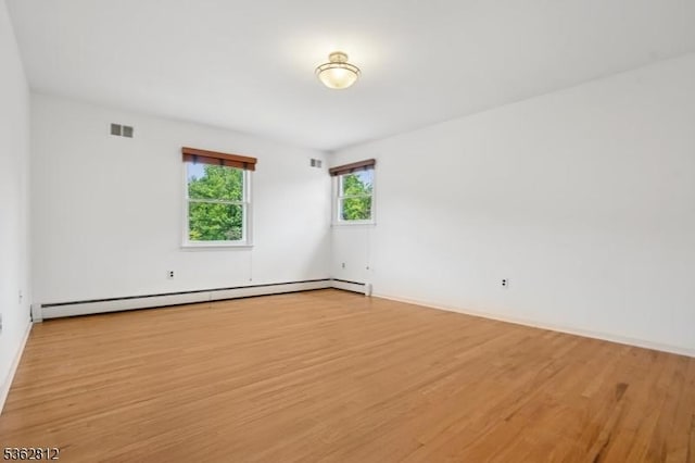 8 Debra Ct, Scotch Plains Twp, NJ 07076 - unfurnished room with baseboard heating, light wood finished floors, and baseboards