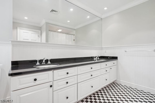 8 Debra Ct, Scotch Plains Twp, NJ 07076 - bathroom featuring crown molding, double vanity, tile patterned floors, a wainscoted wall, and recessed lighting