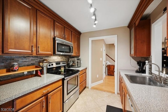 13 Oklahoma Trl, Hopatcong Boro, NJ 07843 - kitchen featuring stainless steel appliances, decorative backsplash, light countertops, and light tile patterned floors