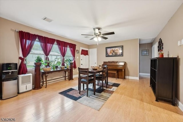 13 Oklahoma Trl, Hopatcong Boro, NJ 07843 - dining space with baseboard heating, light wood-type flooring, and a ceiling fan
