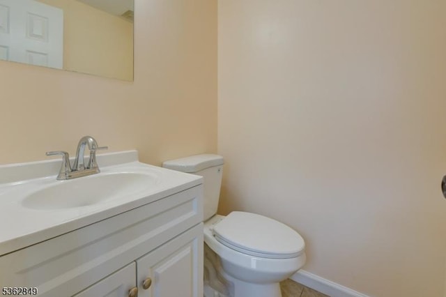 145 S Arlington Ave Unit C, East Orange City, NJ 07018 - half bathroom featuring toilet, vanity, tile patterned flooring, and baseboards