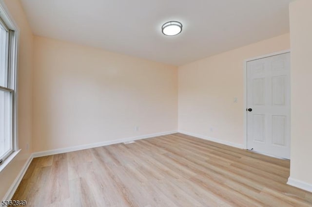 145 S Arlington Ave Unit C, East Orange City, NJ 07018 - empty room with light wood-style floors, healthy amount of natural light, and baseboards