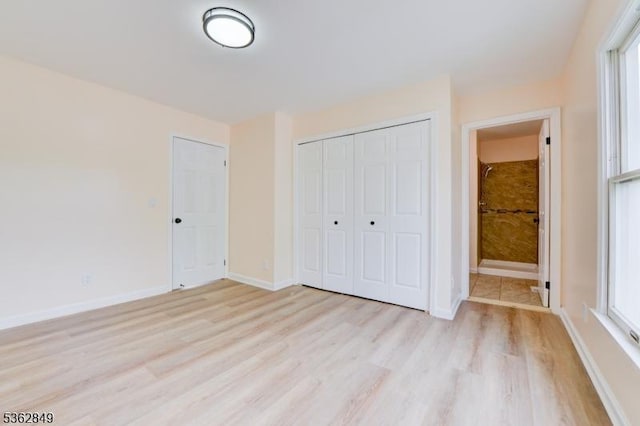 145 S Arlington Ave Unit C, East Orange City, NJ 07018 - unfurnished bedroom with light wood-type flooring, a closet, and baseboards