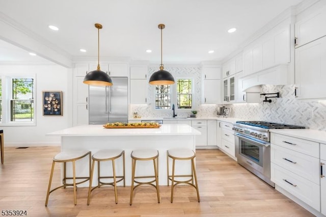 519 Lenox Ave, Westfield Town, NJ 07090 - kitchen with high quality appliances, a sink, a kitchen bar, white cabinets, and recessed lighting
