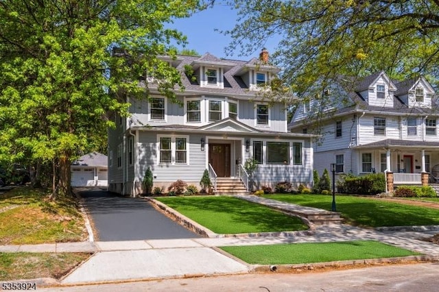 519 Lenox Ave, Westfield Town, NJ 07090 - traditional style home with an outdoor structure, a detached garage, a chimney, board and batten siding, and a front lawn