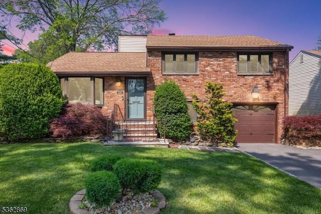 219 Elm Ct, Scotch Plains Twp, NJ 07076 - split level home with a garage, asphalt driveway, a front yard, a shingled roof, and a chimney