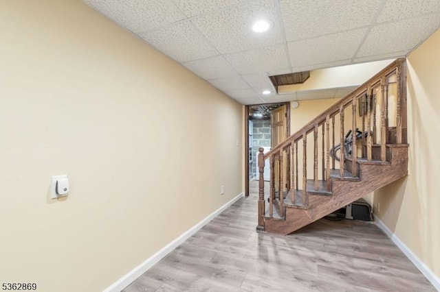 219 Elm Ct, Scotch Plains Twp, NJ 07076 - staircase featuring baseboards, recessed lighting, a drop ceiling, and wood finished floors