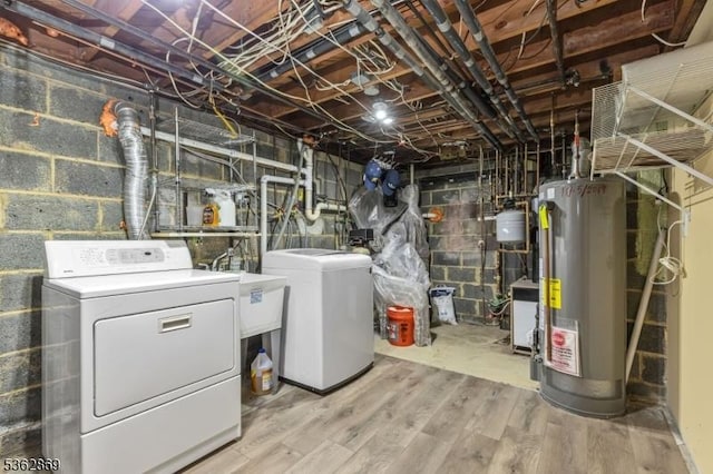 219 Elm Ct, Scotch Plains Twp, NJ 07076 - unfinished below grade area featuring water heater, washing machine and dryer, and light wood finished floors
