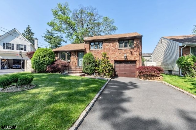 219 Elm Ct, Scotch Plains Twp, NJ 07076 - split level home featuring brick siding, asphalt driveway, an attached garage, and a front yard