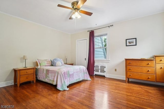 261 Brooklake Rd, Florham Park Boro, NJ 07932 - bedroom with radiator, wood finished floors, baseboards, crown molding, and ceiling fan