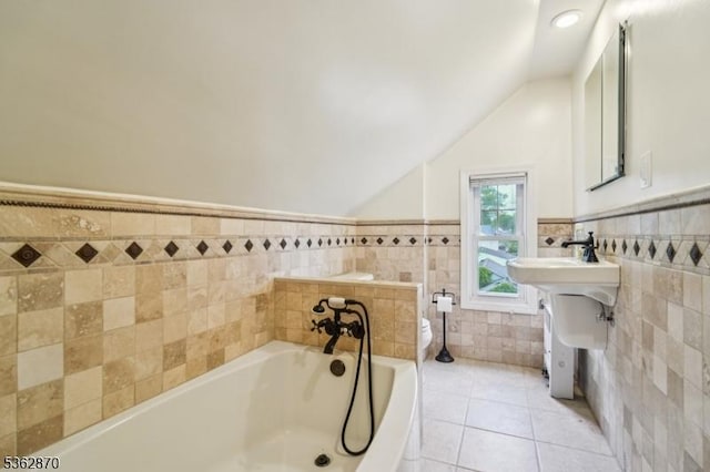 261 Brooklake Rd, Florham Park Boro, NJ 07932 - full bathroom featuring tile walls, toilet, a bath, vaulted ceiling, and tile patterned floors