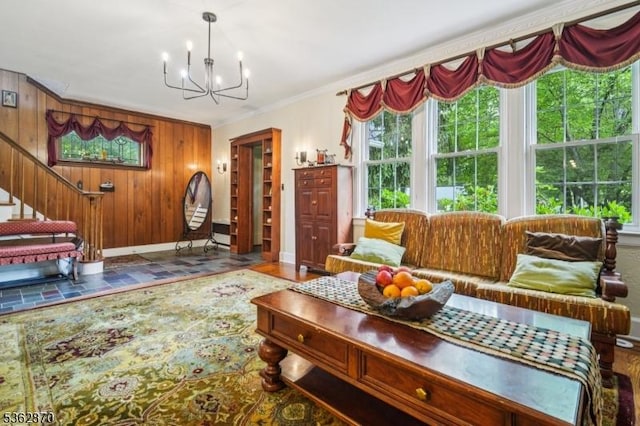 261 Brooklake Rd, Florham Park Boro, NJ 07932 - living area featuring a chandelier, baseboards, wooden walls, stairs, and crown molding