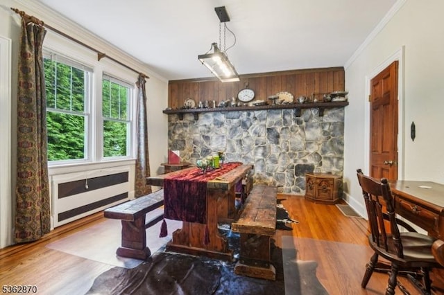 261 Brooklake Rd, Florham Park Boro, NJ 07932 - dining space featuring ornamental molding, wood finished floors, and bar area