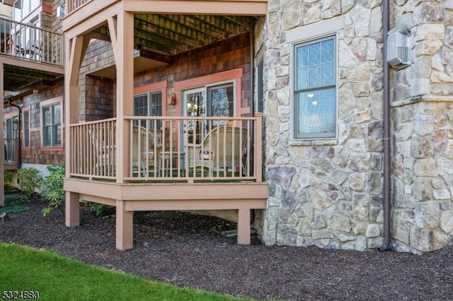 5 Pine Cres Unit 11, Vernon Twp, NJ 07462 - view of property exterior featuring stone siding and a deck