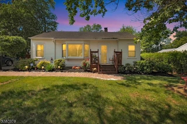 38 Hawthorne Dr, Franklin Twp, NJ 08873 - view of front of house with a lawn and a chimney