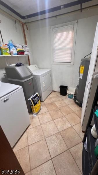 89 Mackerley Rd, Green Twp, NJ 07860 - washroom featuring washing machine and clothes dryer, electric water heater, and light tile patterned floors