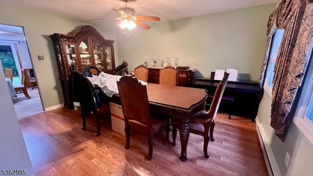 89 Mackerley Rd, Green Twp, NJ 07860 - dining area featuring wood finished floors, a ceiling fan, and a baseboard radiator