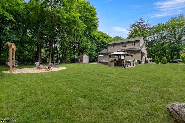 5 N Rose Ln, Mount Olive Twp, NJ 07828 - view of grassy yard featuring an outdoor fire pit, a gazebo, and view of wooded area
