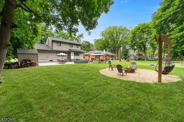 5 N Rose Ln, Mount Olive Twp, NJ 07828 - view of green lawn featuring an outdoor fire pit and a patio area