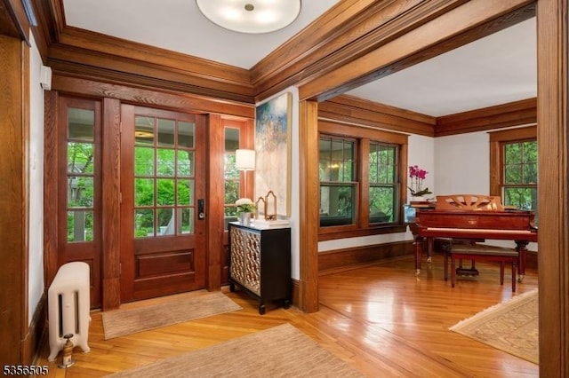 34 Crane Rd, Mountain Lakes Boro, NJ 07046 - foyer with radiator, light wood finished floors, plenty of natural light, and ornamental molding