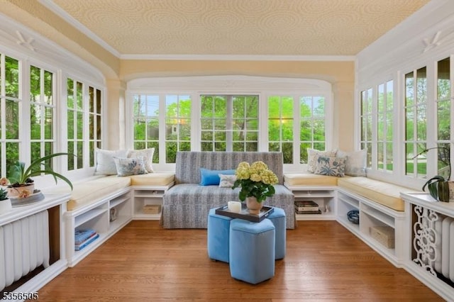 34 Crane Rd, Mountain Lakes Boro, NJ 07046 - sunroom with french doors, healthy amount of natural light, crown molding, and wood-type flooring