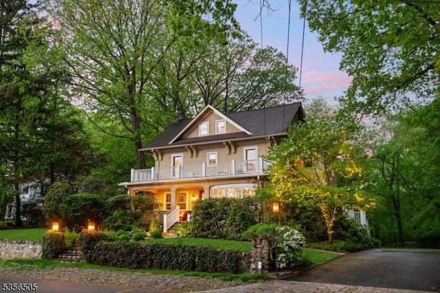 34 Crane Rd, Mountain Lakes Boro, NJ 07046 - view of front facade with a balcony, stucco siding, and stairway