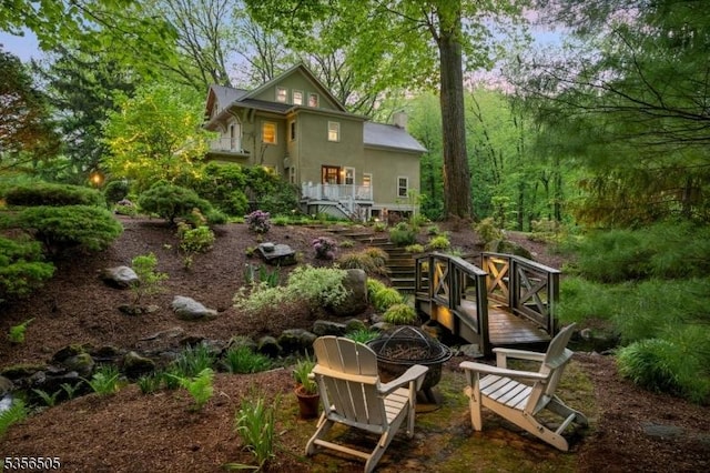 34 Crane Rd, Mountain Lakes Boro, NJ 07046 - rear view of house with an outdoor fire pit, stairs, a deck, and stucco siding