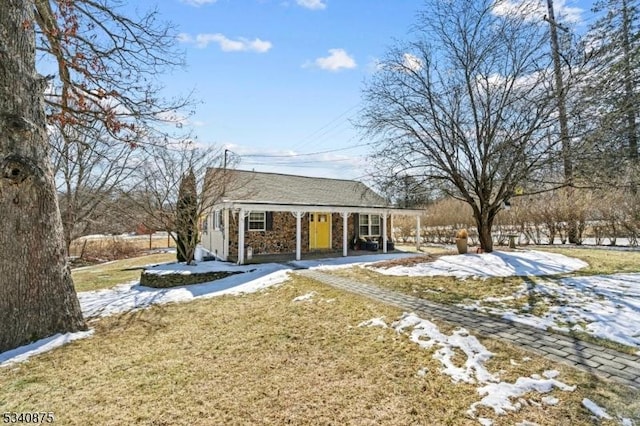 42 Stehr St, Frankford Twp, NJ 07826 - snow covered back of property featuring a yard, a porch, and stone siding