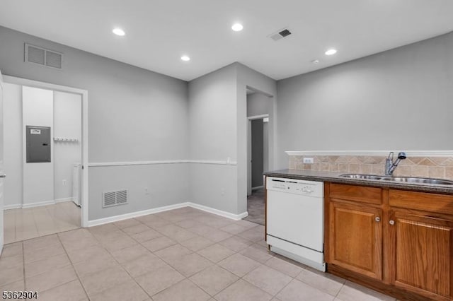 1206 Conrad Way, Franklin Twp, NJ 08873 - kitchen with dishwasher, a sink, electric panel, dark countertops, and brown cabinetry