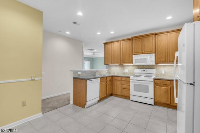 1206 Conrad Way, Franklin Twp, NJ 08873 - kitchen featuring white appliances, a peninsula, baseboards, recessed lighting, and backsplash
