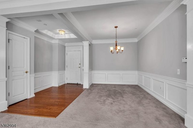 1206 Conrad Way, Franklin Twp, NJ 08873 - unfurnished dining area featuring carpet, ornamental molding, a chandelier, a wainscoted wall, and a decorative wall