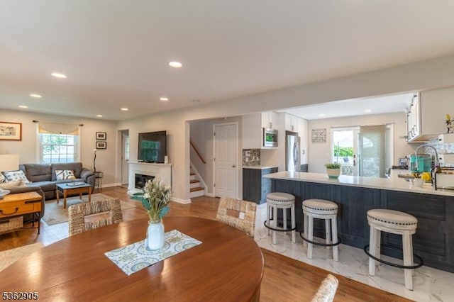 550 Melrose Ave, South Plainfield Boro, NJ 07080 - dining room featuring stairs, a glass covered fireplace, and recessed lighting