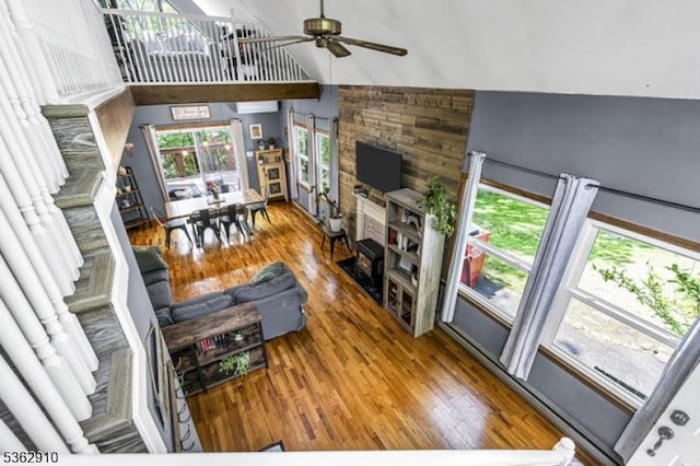 72 Quenby Mountain Rd, Liberty Twp, NJ 07838 - living room featuring hardwood / wood-style floors, high vaulted ceiling, ceiling fan, and wood walls