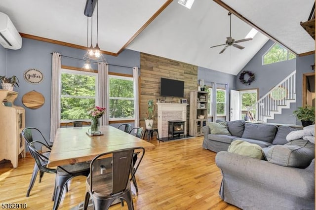 72 Quenby Mountain Rd, Liberty Twp, NJ 07838 - living area featuring a wall mounted air conditioner, stairway, light wood-type flooring, a ceiling fan, and high vaulted ceiling
