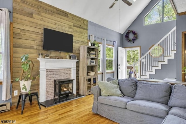 72 Quenby Mountain Rd, Liberty Twp, NJ 07838 - living room with high vaulted ceiling, ceiling fan, wood finished floors, wood walls, and stairs